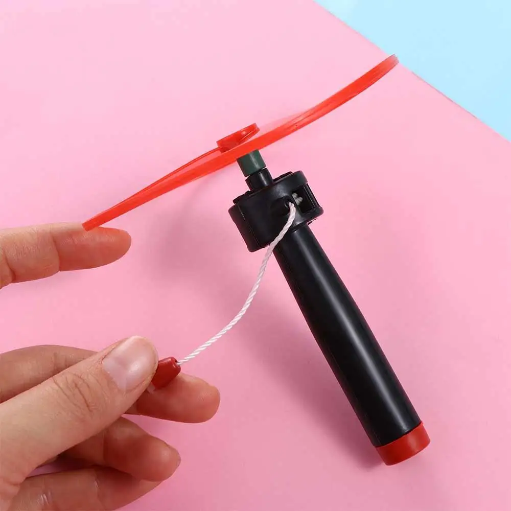 kf-Sb73e972cbd574dacac557ffe795afb2a9-Pull-String-Pull-String-Flying-Disc-Outdoor-Toys-Flying-Spin-Top-Propeller-Helicopter-Outdoor-Toys-Random